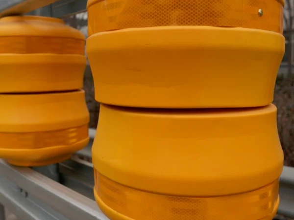 Highway Roller Barrier System with Impact Absorption for Road Safety